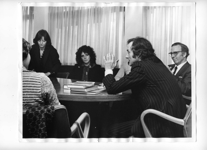 Sunday Times editor Harold Evans launches the City University's new postgraduate diploma course in journalism with some down-to-earth advice. On right, Tom Welsh, the university's director of journalism, listens in. (Press Gazette, October 25, 1976) (The students are, left to right, Sue Landau, Jacky Law, and Sarah Bayliss.